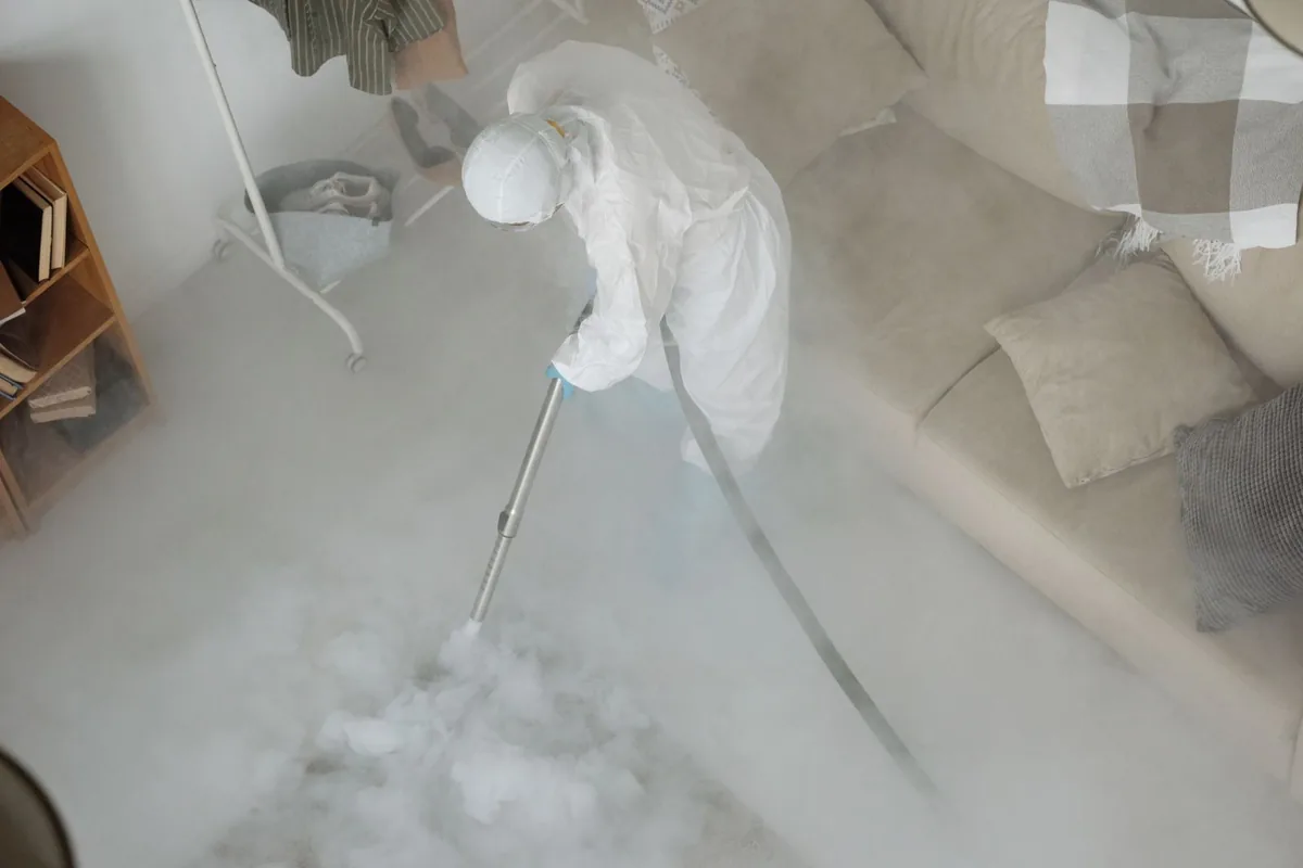 Biohazard cleanup technician in protective equipment, Republic, PA